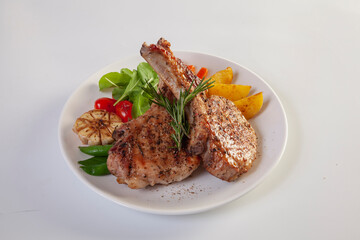 pork chop with vegetable in plate