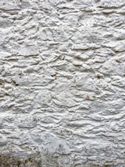 Fototapeta premium Stone wall texture. Part of old rocky hand crafted background with copy space. Walls made of natural bricks. High quality photo. Home and office design backdrop