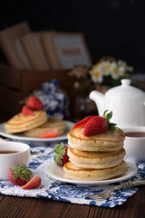 stack of pancakes with strawberries