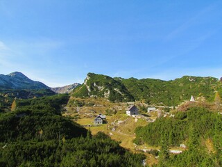 View of mountain lodge under Bogatin at Komna in Triglav national park and Julian alps at Gorenjska...