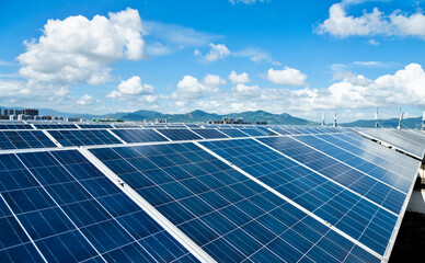 Solar panels against blue sky background