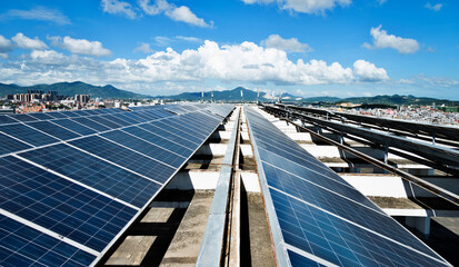Solar panels against blue sky background