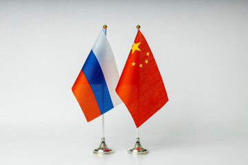 National flags of China and Russia on a light background. State flags.