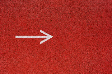 White arrow on red background