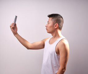 A man in a white vest