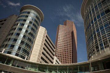 Low angle view of the Chevron Building and its circular sky bridge, Skyline District, Downtown...