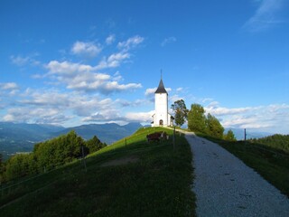 Church of Saints Primus and Felician under Jelovica close to Jamnik village in Gorenjska region of Slovenia lit by sunshine