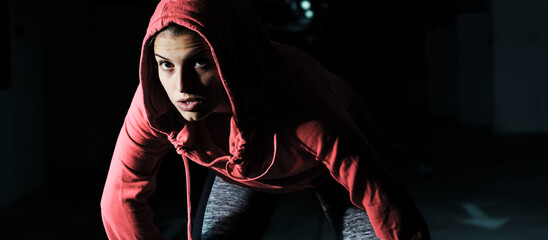 Portrait Of Fitness Woman In Hoodie. Sporty Girl Ready For Running. 