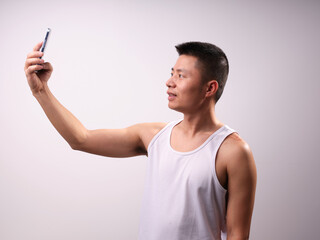 A man in a white vest