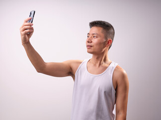 A man in a white vest