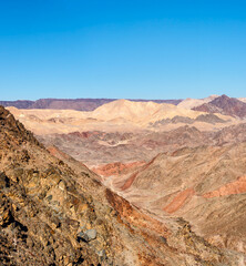 Fototapeta na wymiar Bbright colors rocks in the desert mountains.