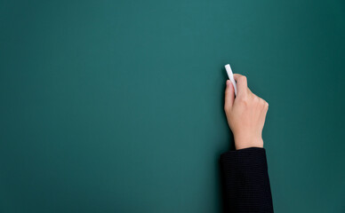 Fototapeta Businesswoman hand writing chalk on blackboard obraz
