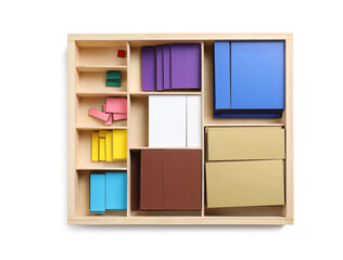 Set of wooden geometrical figures in box isolated on white, top view. Montessori toy