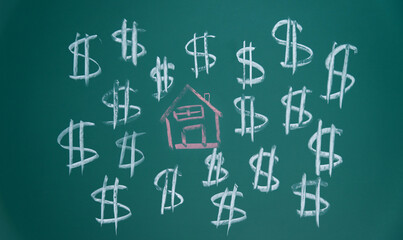 Drawing money and house on blackboard