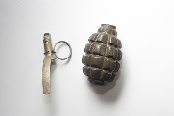 broken practice grenade isolated on white background