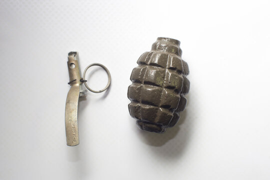 broken practice grenade isolated on white background