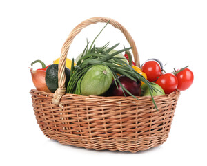Fresh ripe vegetables and fruits in wicker basket on white background