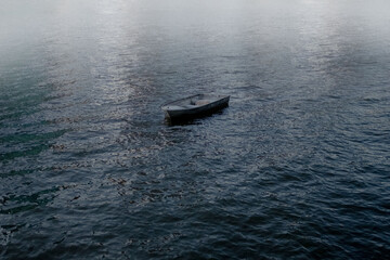 Naklejka premium Lonely Boat on Water
