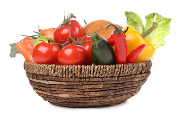 Fresh ripe vegetables and fruit in wicker bowl on white background