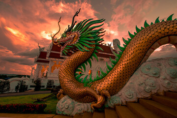 Fototapeta premium Background Chiang Rai Blue Temple or Wat Rong Seua Ten is located in Rong Suea Ten in the district of Rimkok a few kilometers outside Chiang Rai,Thailand