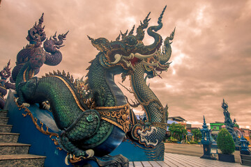 Wat Rong Suea Ten-Chiang Rai:24 September 2021,tmosphere inside the temple,there is an old white Buddha image,tourists from around the world always come to make merit,Rim Kok Subdistrict,Thailand - obrazy, fototapety, plakaty