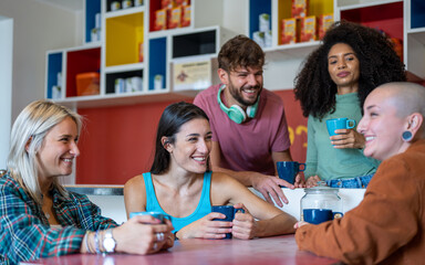 young people from generation z having braekfast in living room of hostel, concept of traveling and...