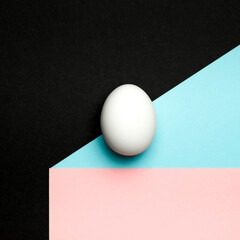 Egg on multi color background. Happy Easter concept. Minimal concept.