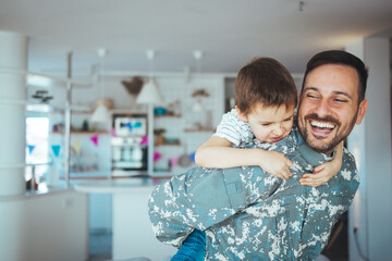 Military man father hugs son. Portrait of happy american family. Happy american family, father with son. Happy male soldier dad reunited with son after US army