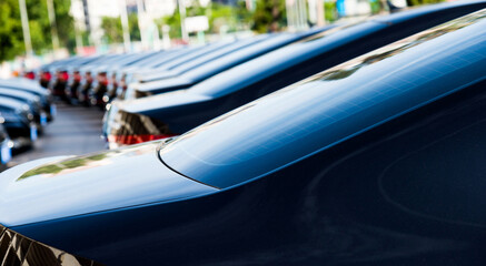 Group of black cars parked in a row