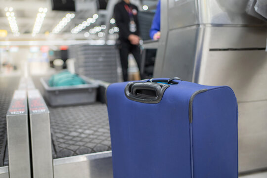 Luggage at check in counter. Bring it to conveyor belt and weight at the international airport with copy space.