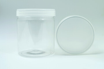 Empty transparent plastic jar with white background