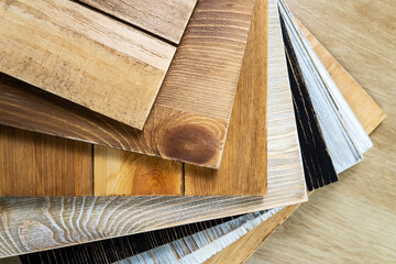 Stack of various construction sample wood boards.