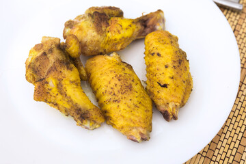 fried chicken wings on white plate
