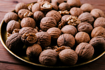 Background of whole and peeled walnuts. Healthy food concept