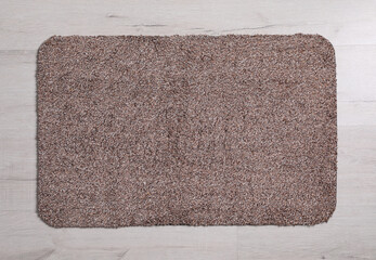 Fototapeta na wymiar New clean door mat on floor, top view