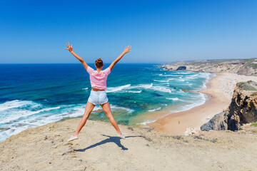 Girl having fun on the ocean. Lagos, Algarve Coast, Portugal - 494218461