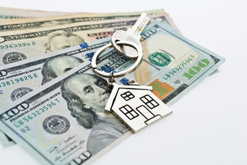 House key over the hundred dollar banknotes