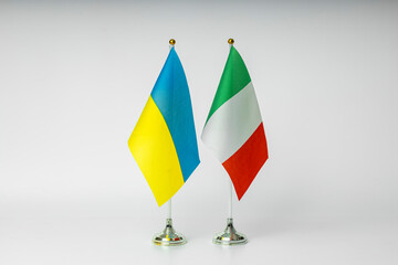 State flags of Ukraine and Italy on a light background. State flags.