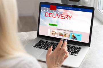 delivery icon on laptop keyboard. Online shopping, ecommerce and retail sale concept, delivery for customers ordering things from retailers websites using internet