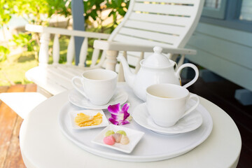 White tea set on white table