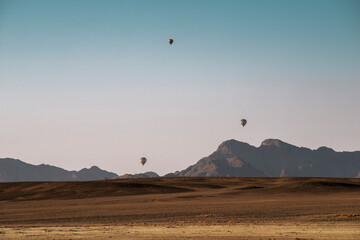 balloons above desert