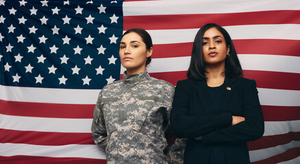Soldier and politician standing against an American flag