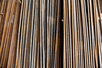 Round steel bars on pile in the warehouse