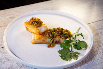 white fish sticks in breadcrumbs on a plate