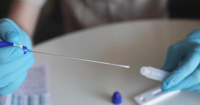 Process of express fast coronavirus covid Antigen AG PCR testing examination at home, COVID-19 swab collection kit, test tube for taking OP NP patient specimen sample, testing carried out

