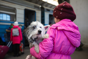 Ukrainian refugees on Lviv railway station waiting for train to escape to Europe