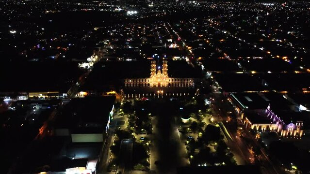 View of the Basilica of Zapopan at night, perspective going backwards.