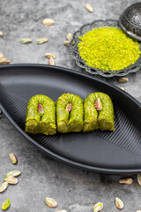 Pistachio Baklava on a dark background. Mediterranean cuisine delicacies. Close-up baklava. local...