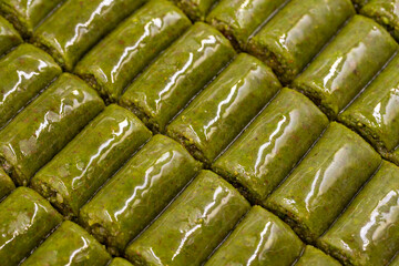 Pistachio wrap baklava dessert. Mediterranean cuisine delicacies. Close-up baklava. local name fistik sarma baklava