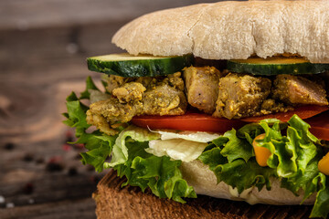 Grilled club sandwich panini with with crispy chicken and salad on cutting board. Turkish chicken...